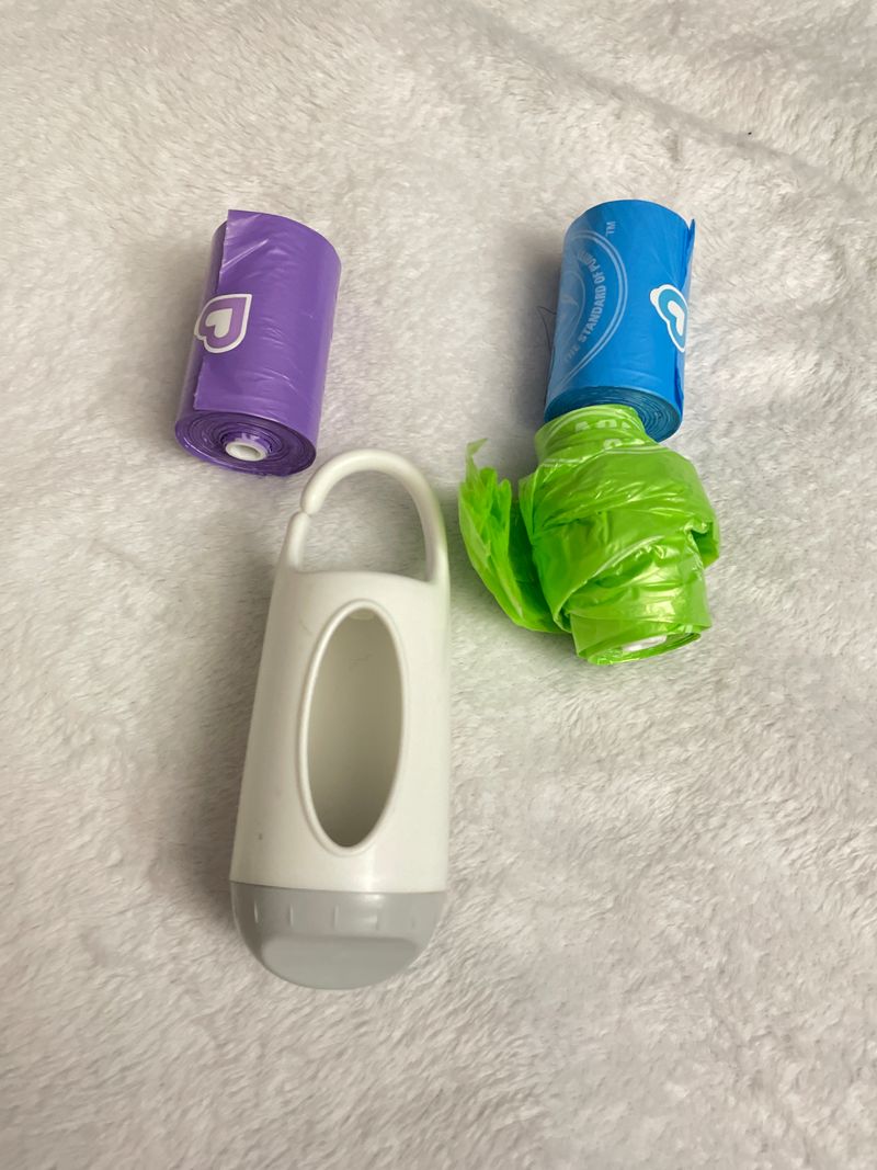 Munchkin Poop bag hook holder with disposable bags Potty and Diapering