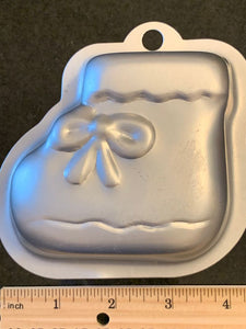 Wilton baby bootie mini cake pan. Equivalent in in size to about 2 cupcakes. Used 1 time. EUC!