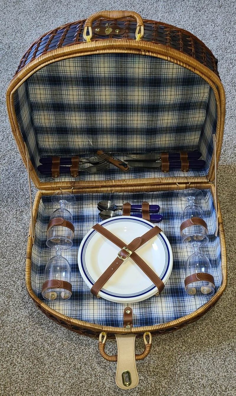 Picnic Basket Only used a few times Blue and brown woven picnic basket with everything inside.