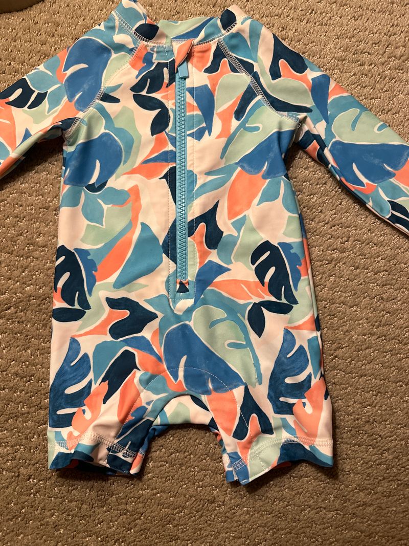 3-6 long sleeve swim outfit It does have pink in it but looks more boy to me 3 Months