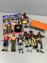 Load image into Gallery viewer, WWE wrestler figures and props 6 full size figures, table prop, book, wristband Figures and Animals
