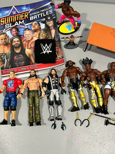 WWE wrestler figures and props 6 full size figures, table prop, book, wristband Figures and Animals