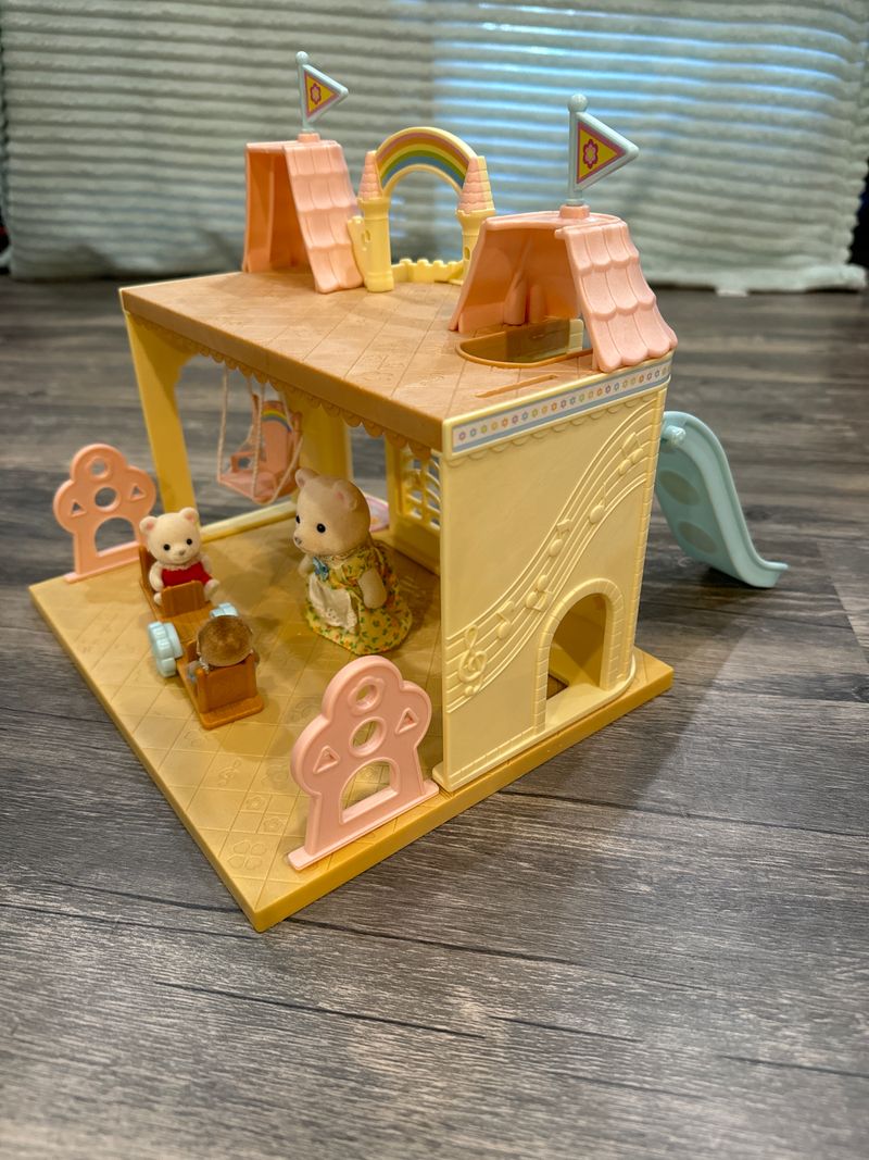 Calico Critters Baby Nursery Castle and 3 critters EUC. Has a slide, teeter totter, and swing. Dolls and Accessories