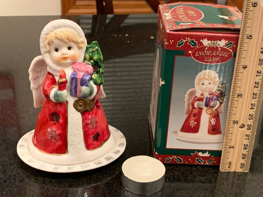 Ceramic Christmas tealight holder, brand new, never used. Snow angel. Includes box.