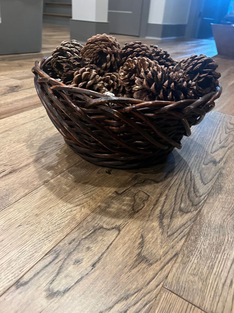 1 large dark brown wicker basket w/ pinecones Round wicker basket 12 inches in diameter