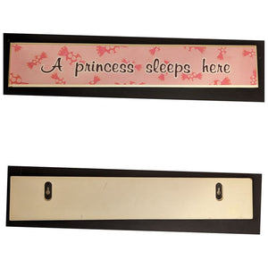 "A princess sleeps here" wall sign, pink w candy 23in by 4in