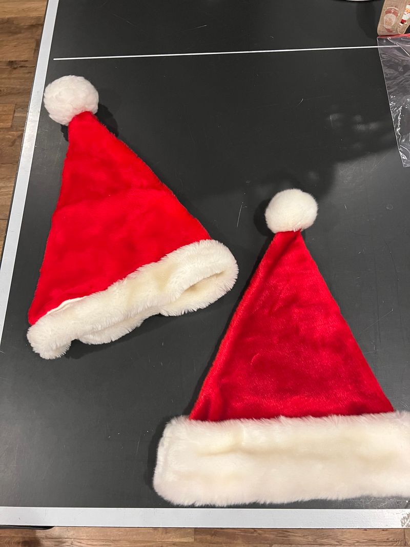 Two Christmas hats Two red velvet with white fur Christmas hats