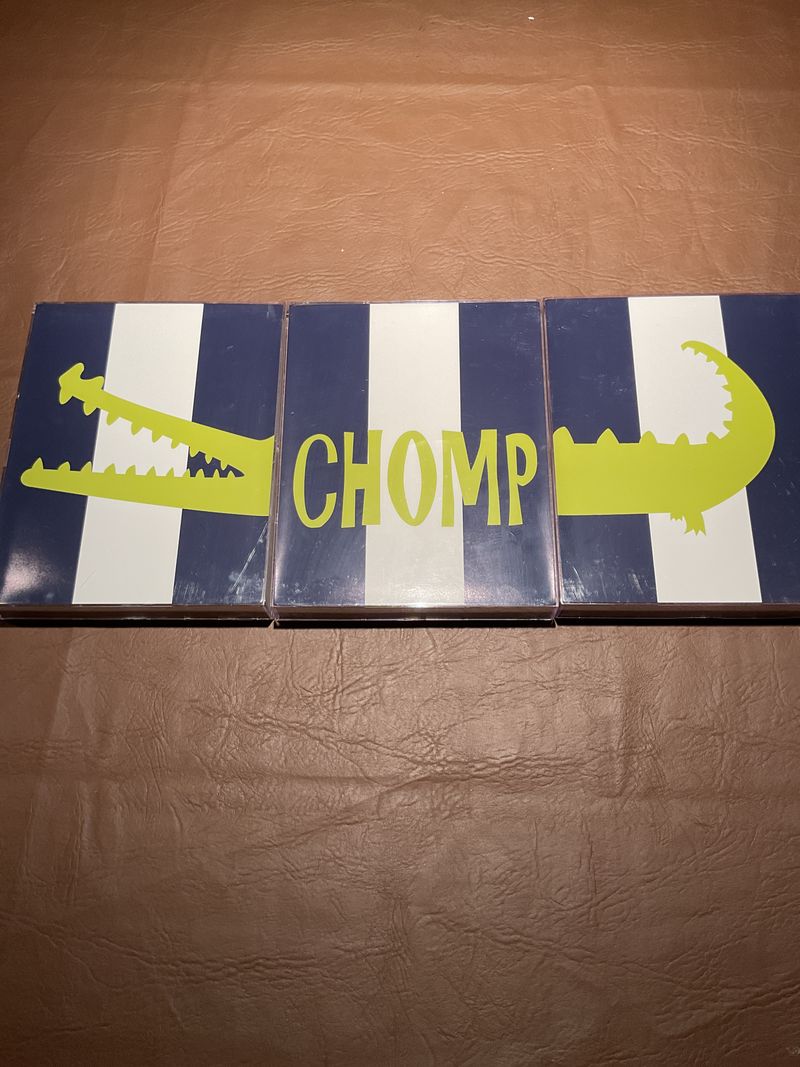 3 plastic frames that spell out Chomp 24 in length Blue/white stripes w/lime green alligator Chomp