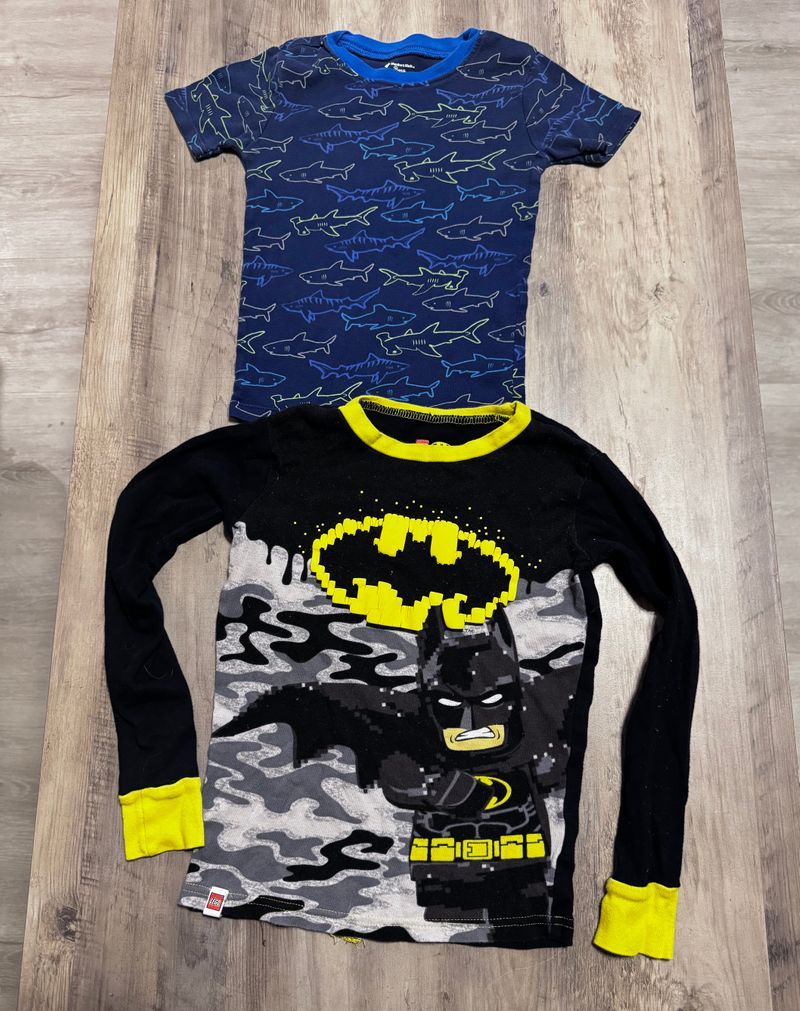 2pajama tops one says 6 one 10 but it runs small sharks and batman 6