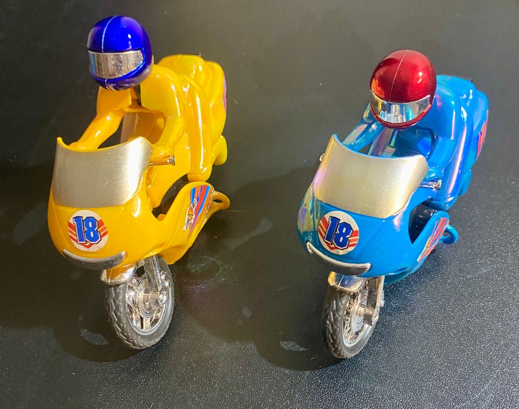Two push and pull motorcycles  Figures and Animals