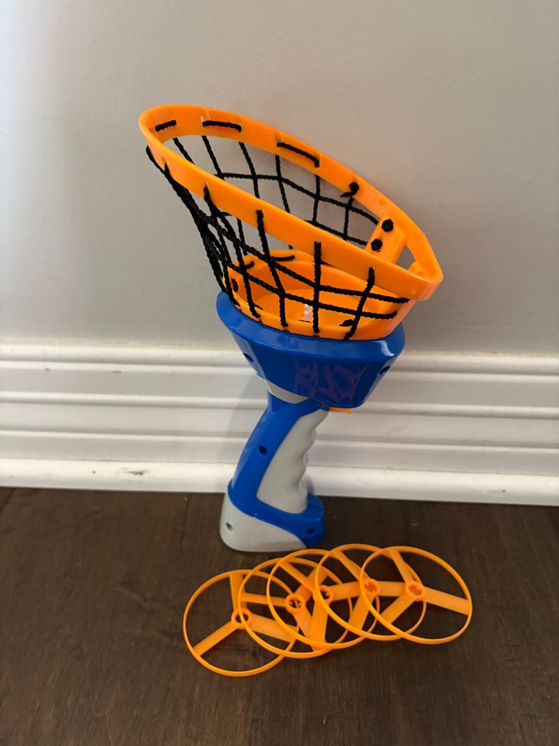 Zoom-O Disc Launcher 5 flying disc launch and catch in net