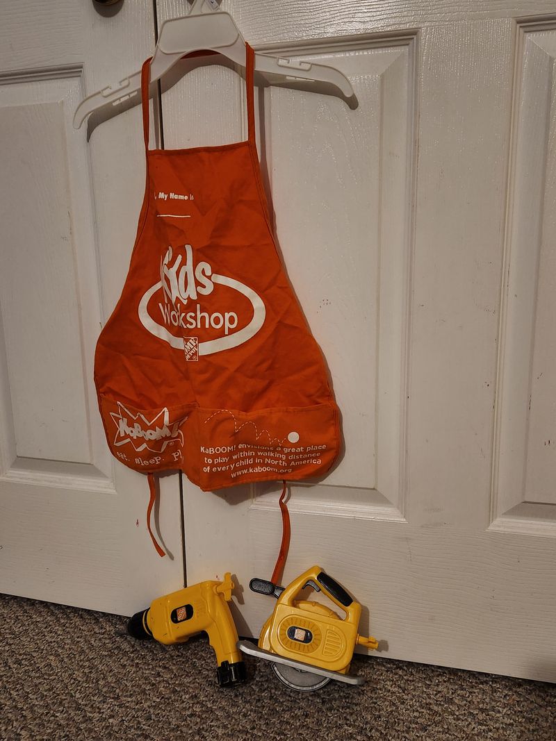 Tools, Home Depot, vest, saw, drill pull string on tools to make noise, a little color scuff Building