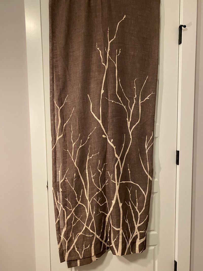 4 Branch design curtains. Brown and tan. Bronze Grommets across top for hanging. 53in W x 83in L