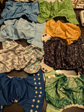 Load image into Gallery viewer, Cloth diaper covers, inserts and 2 wet bags 8 covers, 13 inserts, 6 nwbn inserts, 1 trifold, 2 wet bags Potty and Diapering
