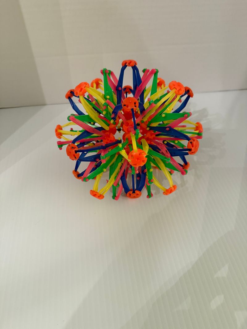 Hoberman expanding Sphere in multicolor expands 6 inches to 15 inches