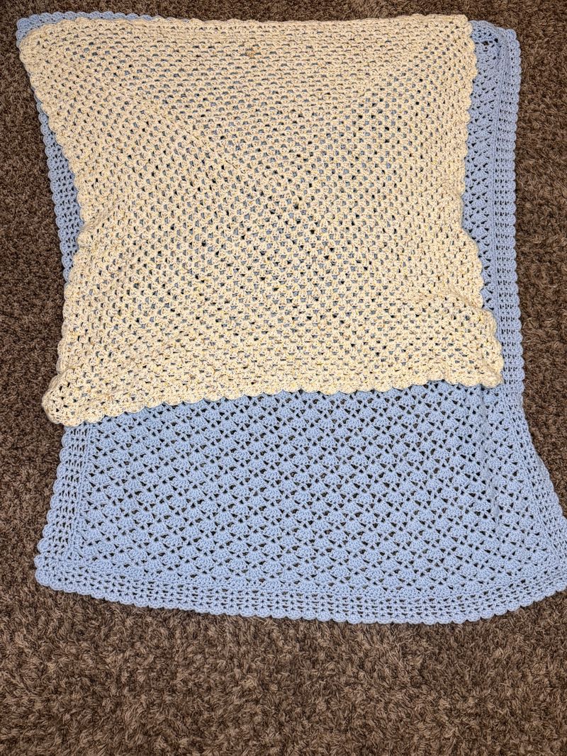2 crochet baby blankets Never used Baby sized blue 4 feet long cream and browns 2 feet long Blanket