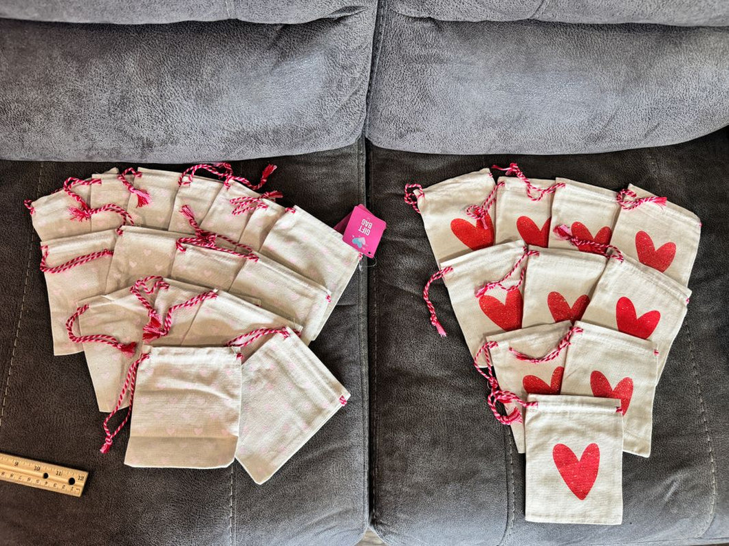 26 Small canvas drawstring pouch 10 red heart pouches, 16 tiny pink heart. Other side, tic tac toe