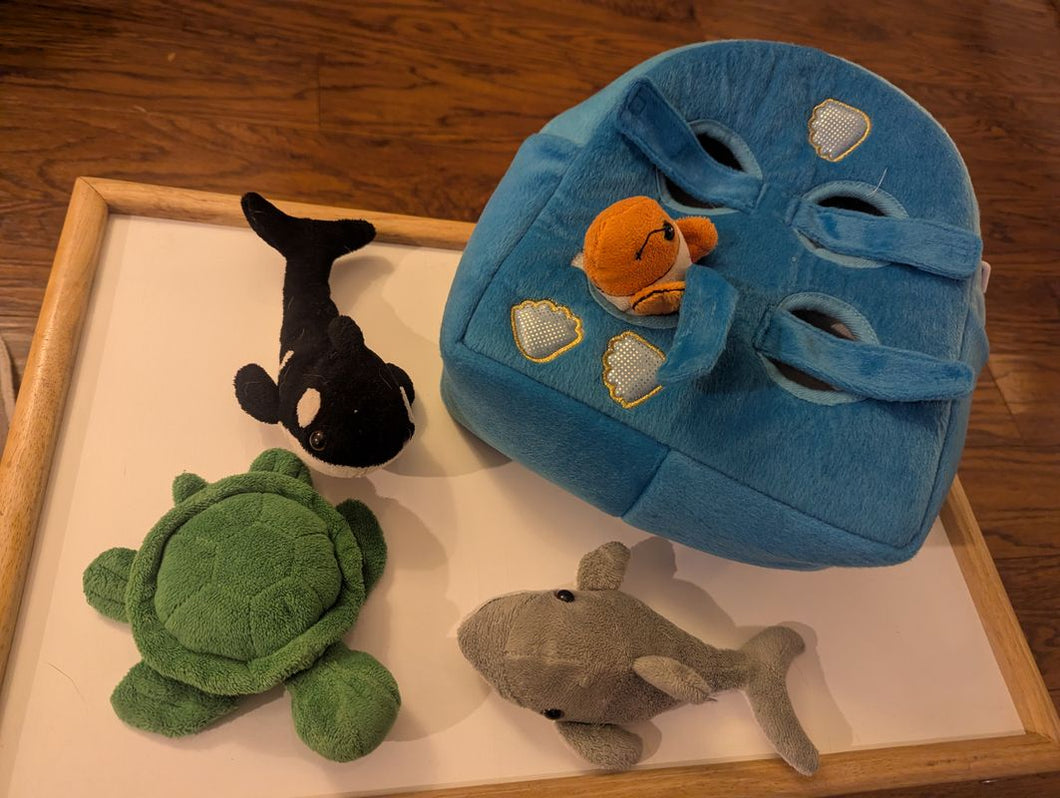 four marine plushes in backpack whale, dolphin, turtle, and clownfish Figures and Animals