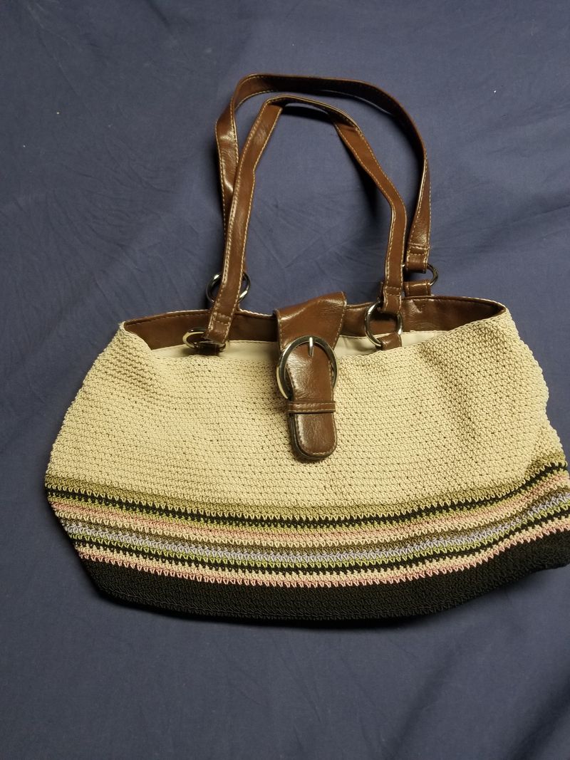Brown leather and crochet purse Inside pockets and leather straps with stripe design