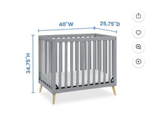 Load image into Gallery viewer, Delta Mini Crib Mini gray w/ maple legs. Teeth marks. Has mattress Crib

