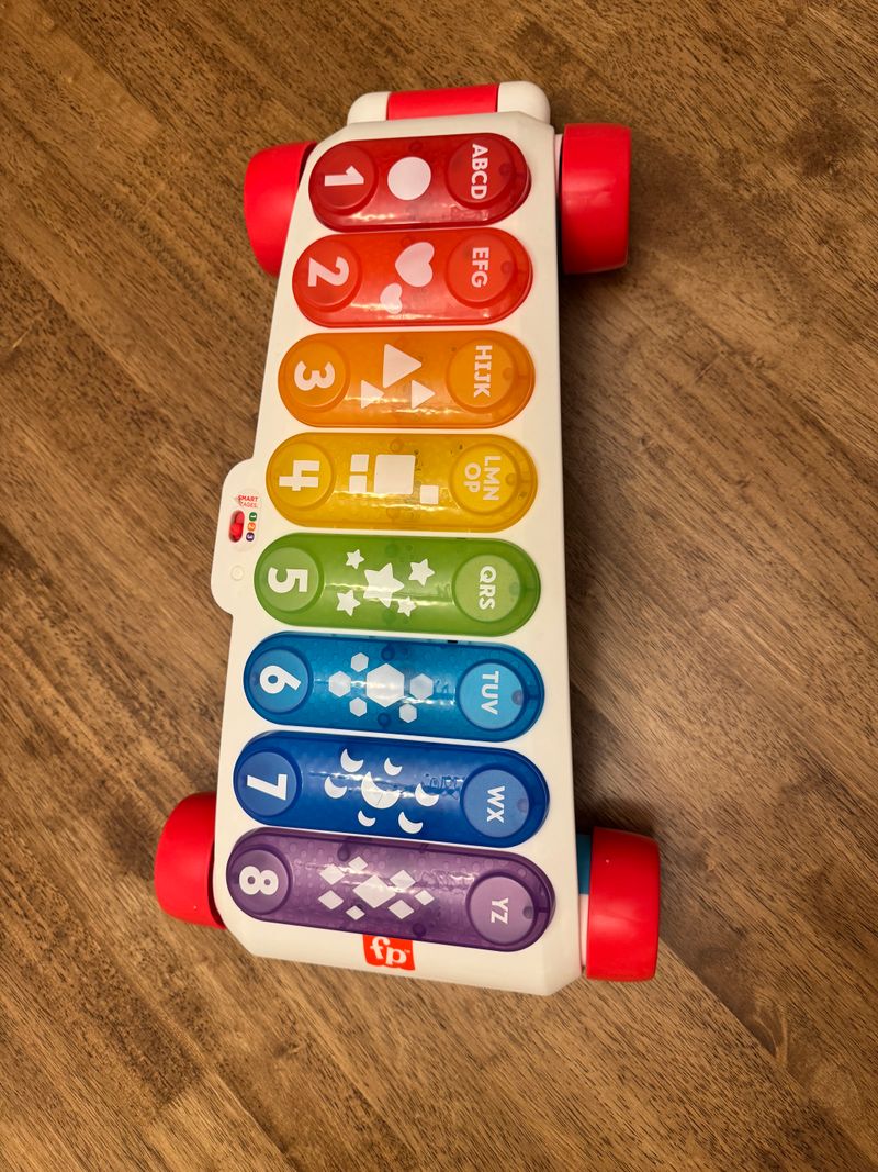 Fisher Price XL xylophone - lights up, does sound Colors and shapes. Has a handle to pull and wheels