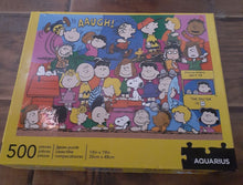 Load image into Gallery viewer, 3pc Peanuts lot metal can with lid, 500pc puzzle and Linus 8&quot; plush doll
