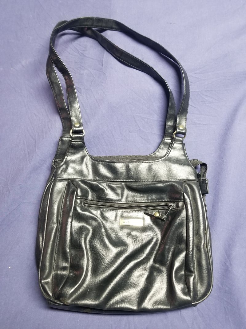 Classics Black leather purse with inside and outside pockets.