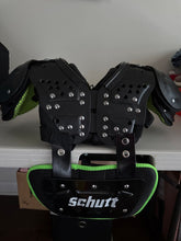 Load image into Gallery viewer, Schutt shoulder pads with back plate size 3XS 9 to 10 inch like new blk and lime green text
