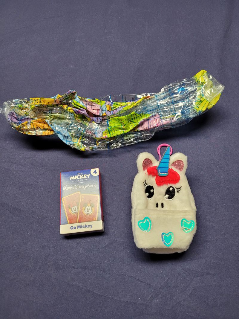 Random assortment of toys Unicorn keychain, cards, and inflatable globe Figures and Animals