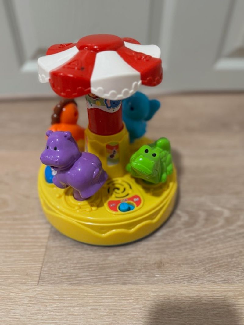 VTech Spin & Learn Color Carousel Carousel sing and spins.  Two settings for songs