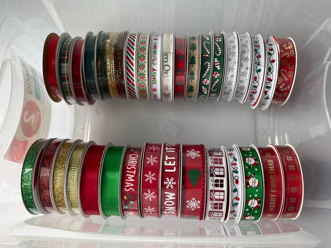 33 rolls of Christmas themed ribbon Many are still NIB / not used