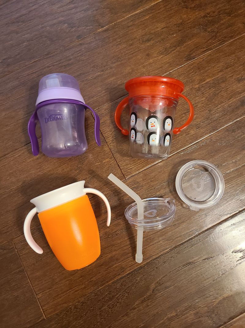 Dr. Brown purple sippy cup, Nuby penguin sippy cup Munchkin orange sippy cup with two extra lids and straw