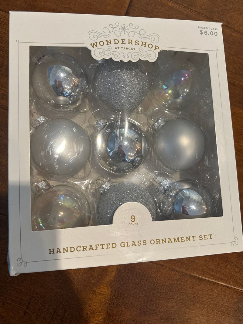 9 silver and clear ornaments. Brand new