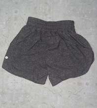 Load image into Gallery viewer, Lululemon, Size 4, Gray Running Shorts Gently Used Condition, Zipper on Side, Size Tag Intact Women's 4
