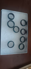 Load image into Gallery viewer, Rings lot Hard plastic it feels like, 8 rings in all,  varies sizes Jewelry
